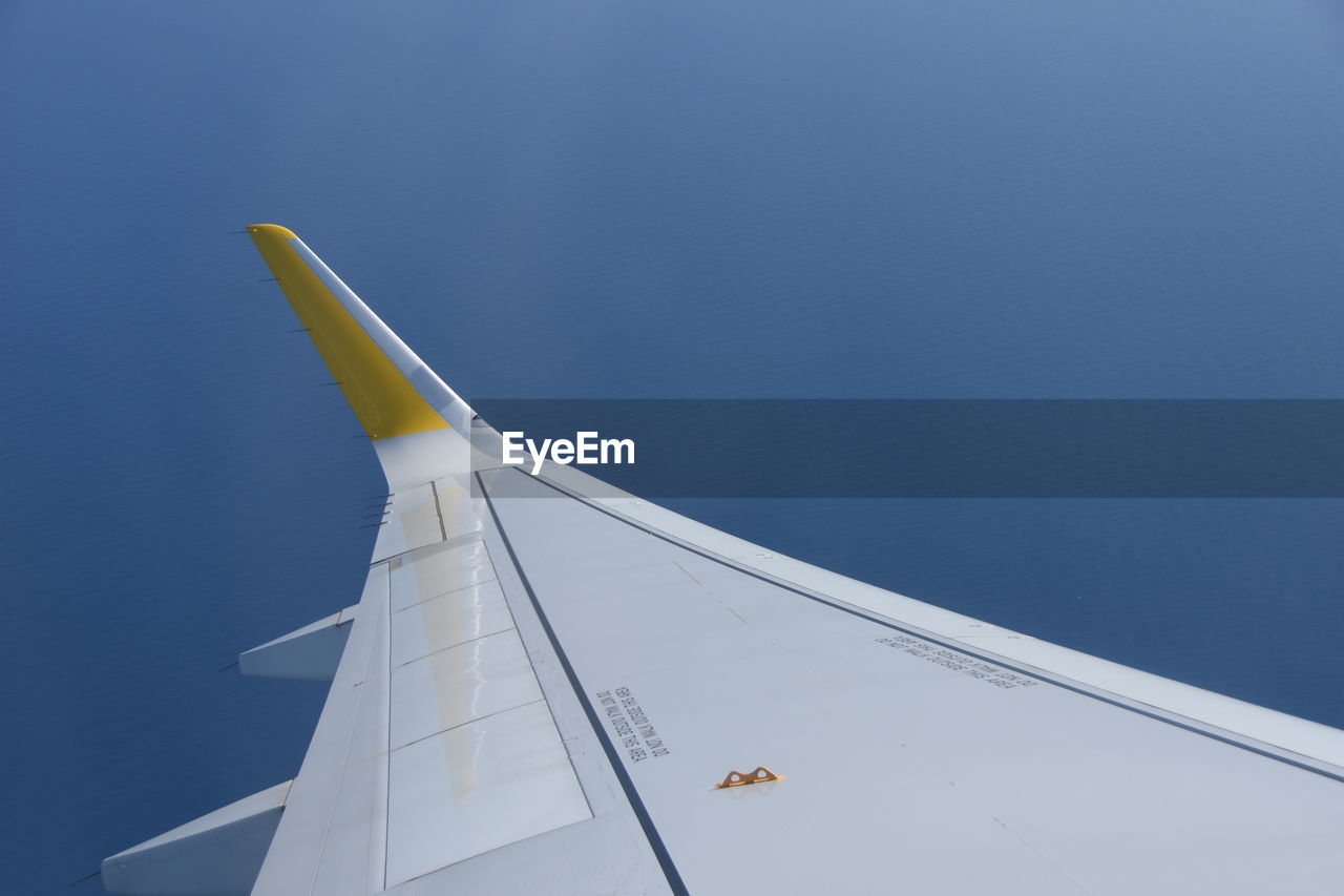 Cropped image of airplane against clear sky