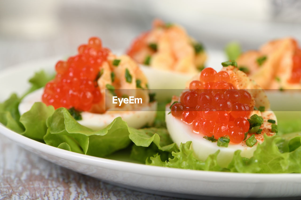 Stuffed eggs with salmon caviar are a popular appetizer for any occasion.  