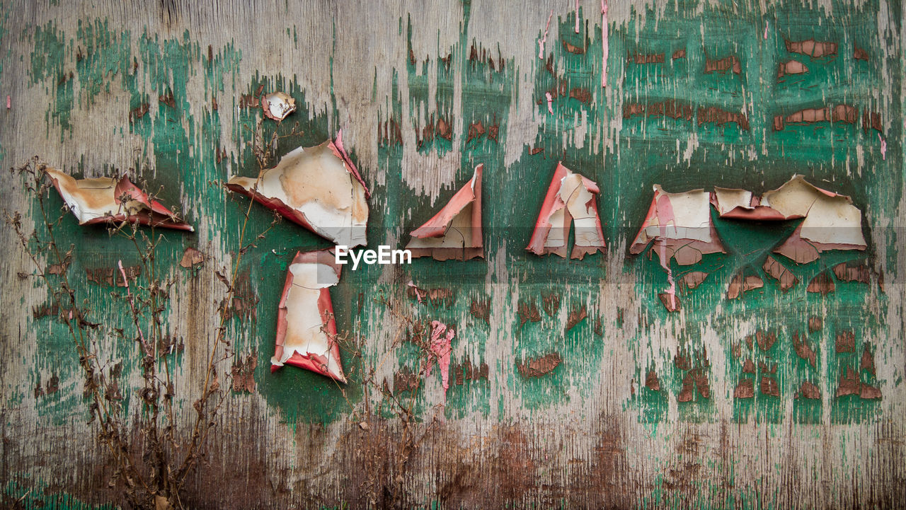 Full frame shot of peeling paint on wall