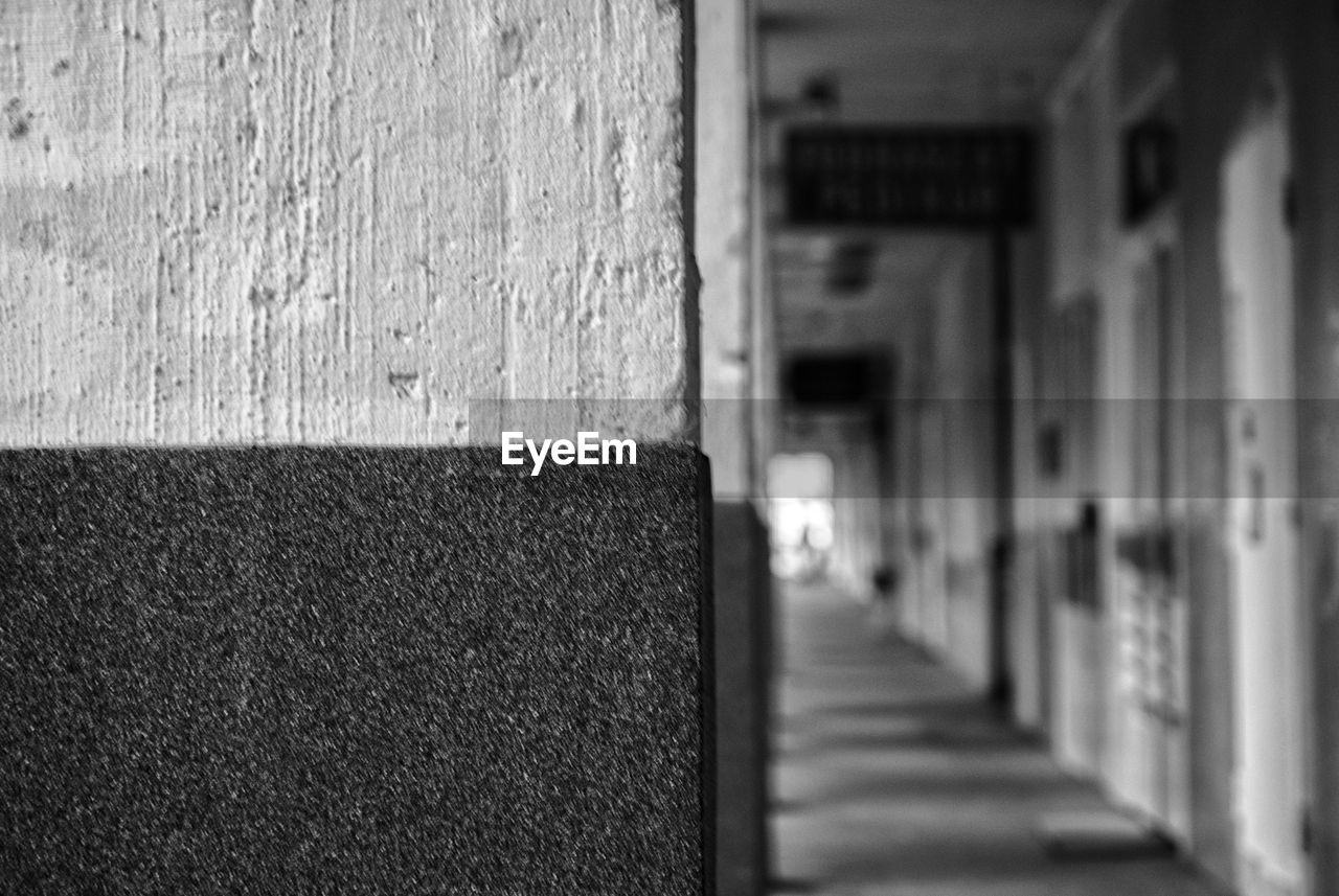 CLOSE-UP OF FOOTPATH AGAINST BUILDING