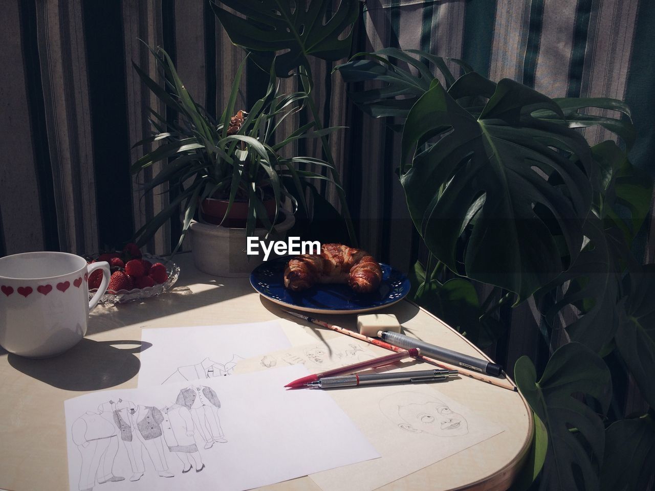 High angle view of drawing with food on table