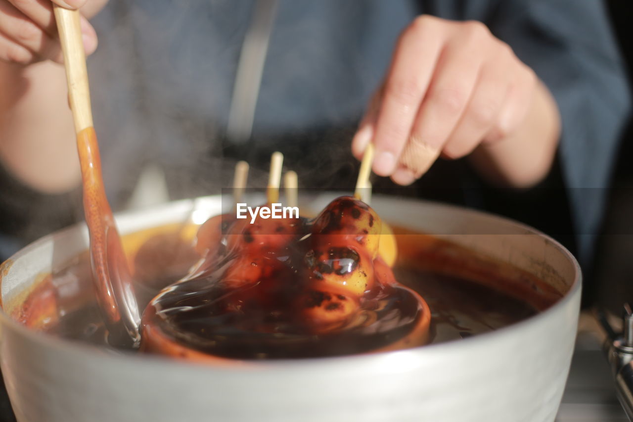 Close-up of person preparing food