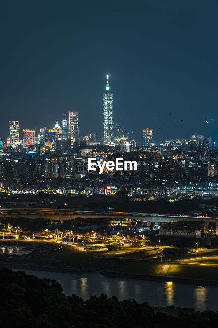 Illuminated buildings in city at night