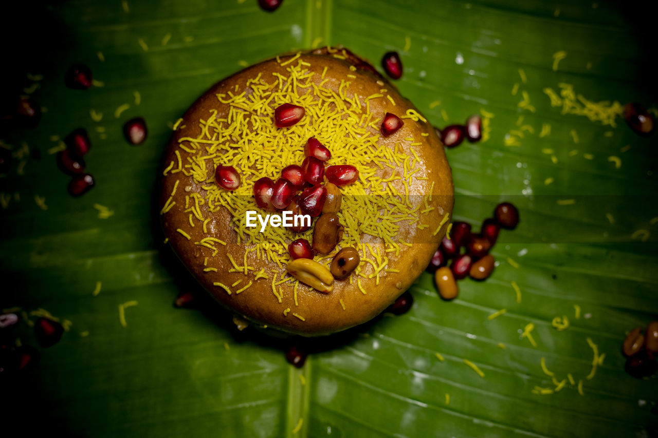 HIGH ANGLE VIEW OF FRUITS ON GREEN LEAF