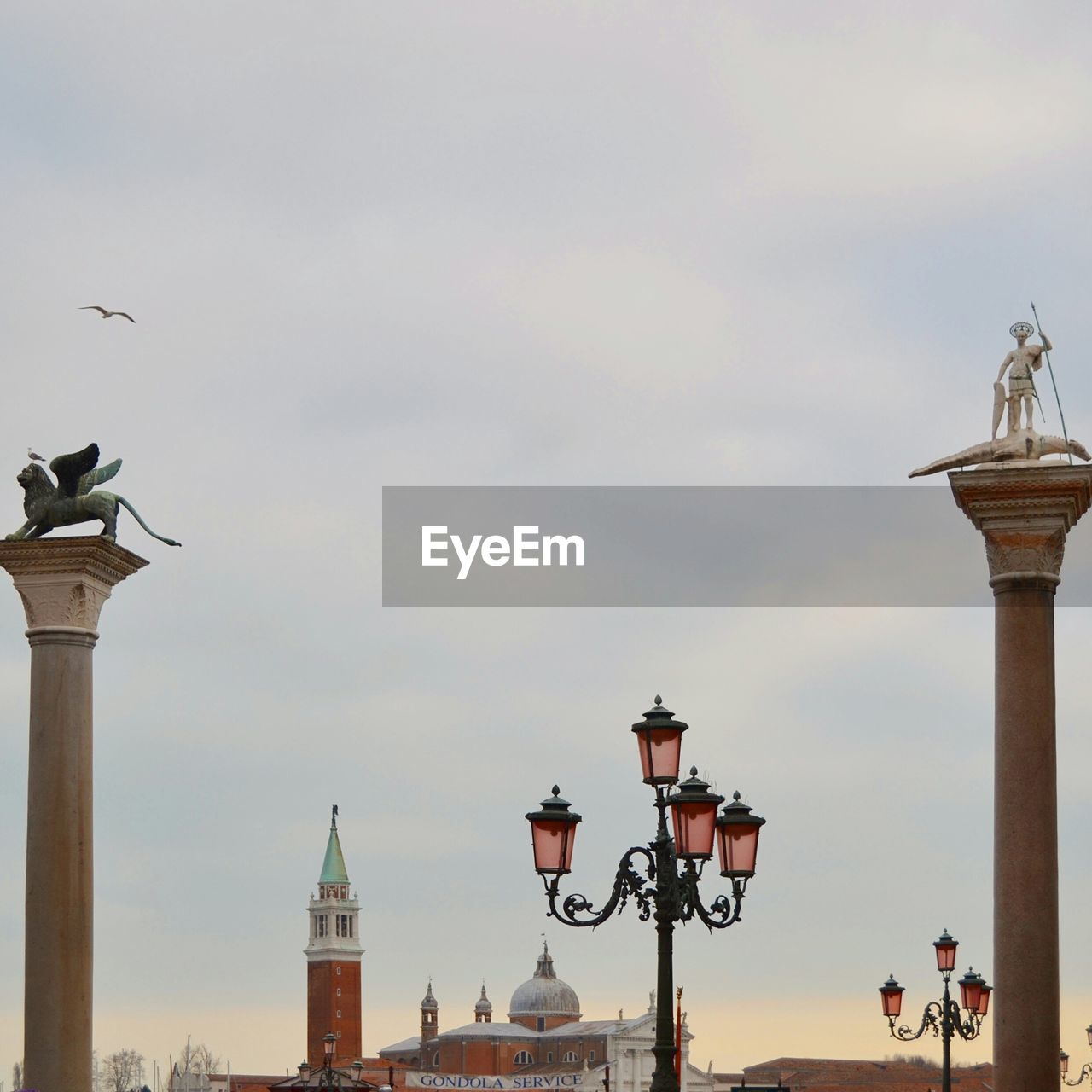 Low angle view of street light and column at piazza san marco