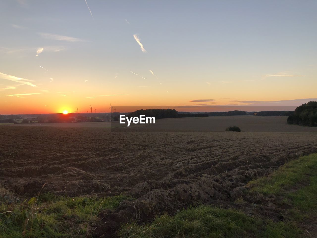 SCENIC VIEW OF SUNSET OVER LAND