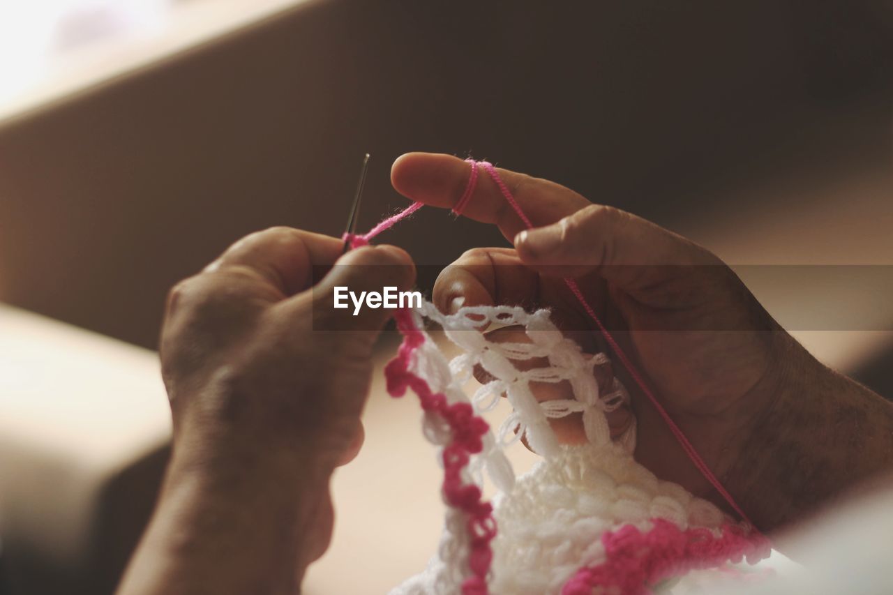 Close-up of woman knitting wool