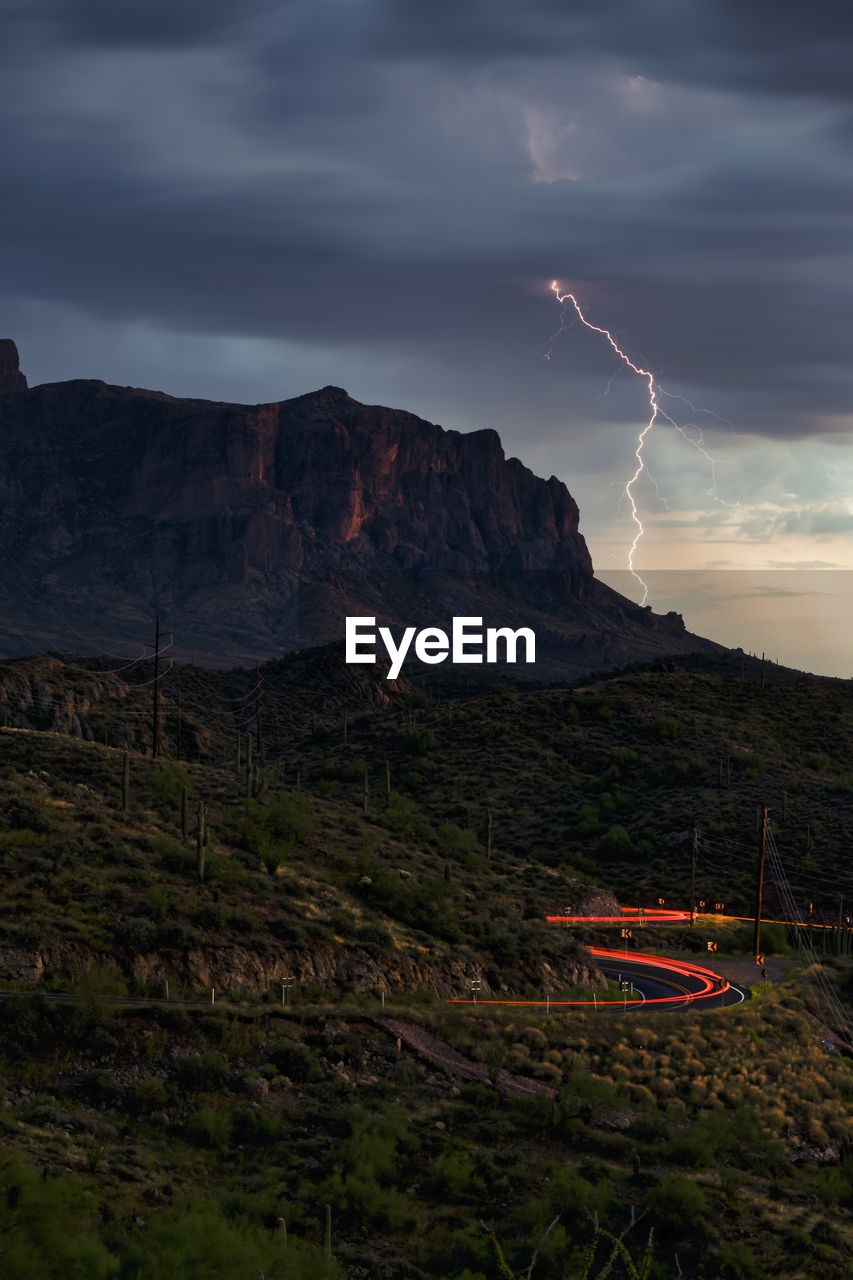 Lightning strikes a hillside near the superstition mountains.