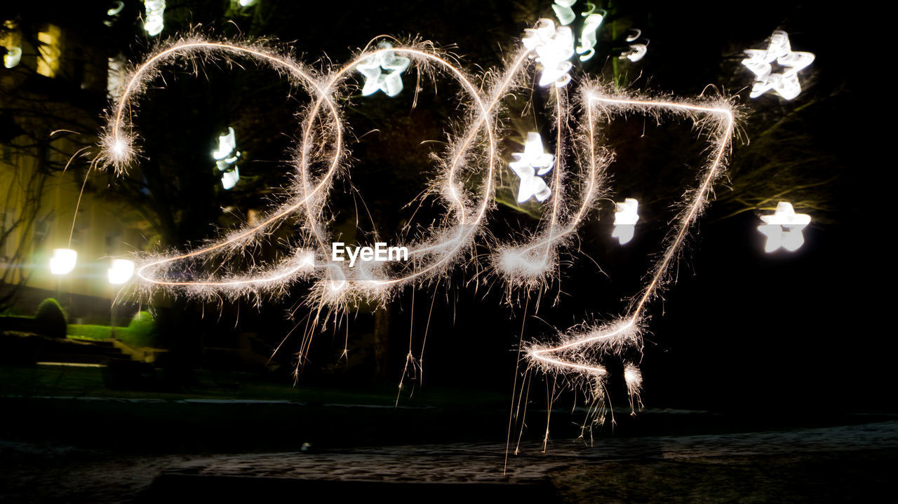 ILLUMINATED FIREWORKS AT NIGHT