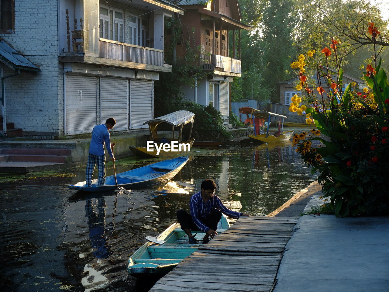 MEN ON WATER IN PARK