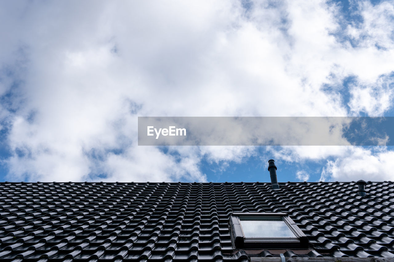 Low angle view of roof of building against sky