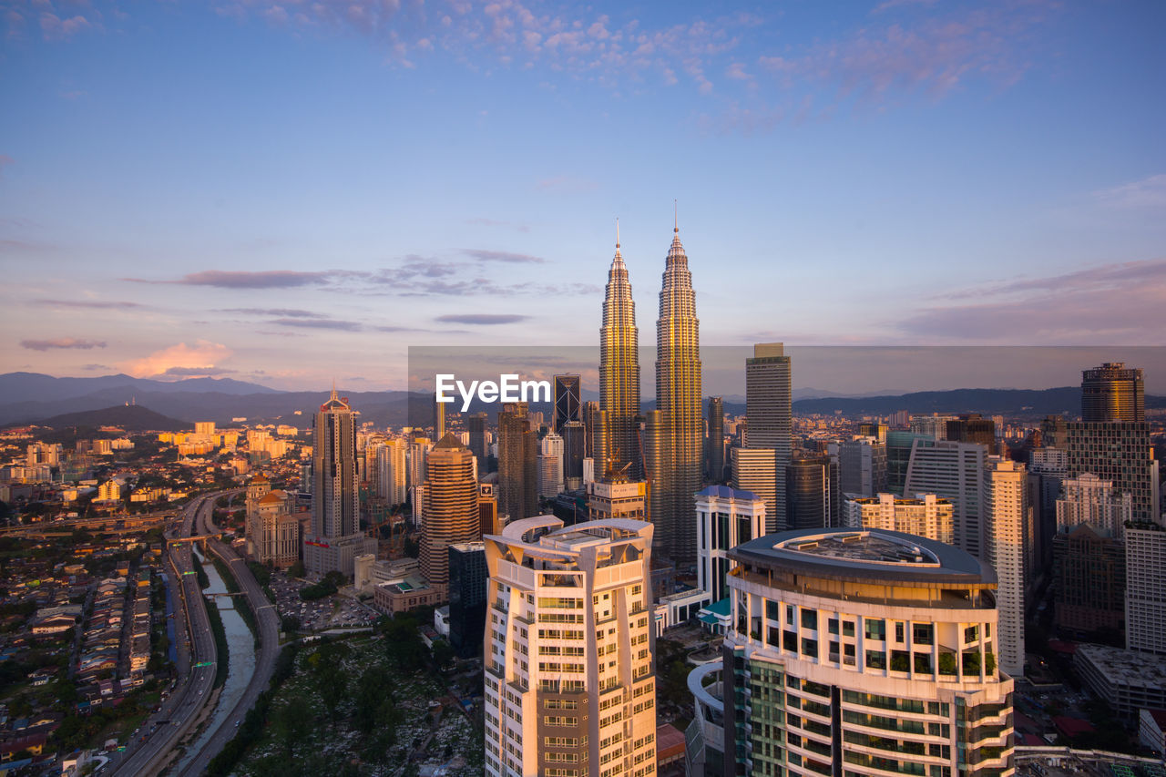 Panoramic view of cityscape against sky during sunset