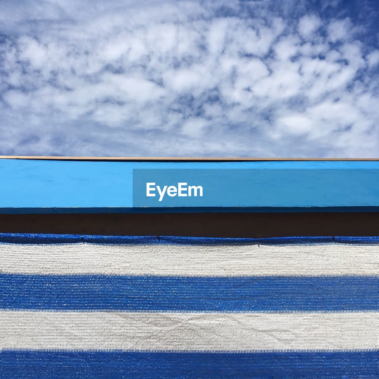 SCENIC VIEW OF BEACH AGAINST BLUE SKY