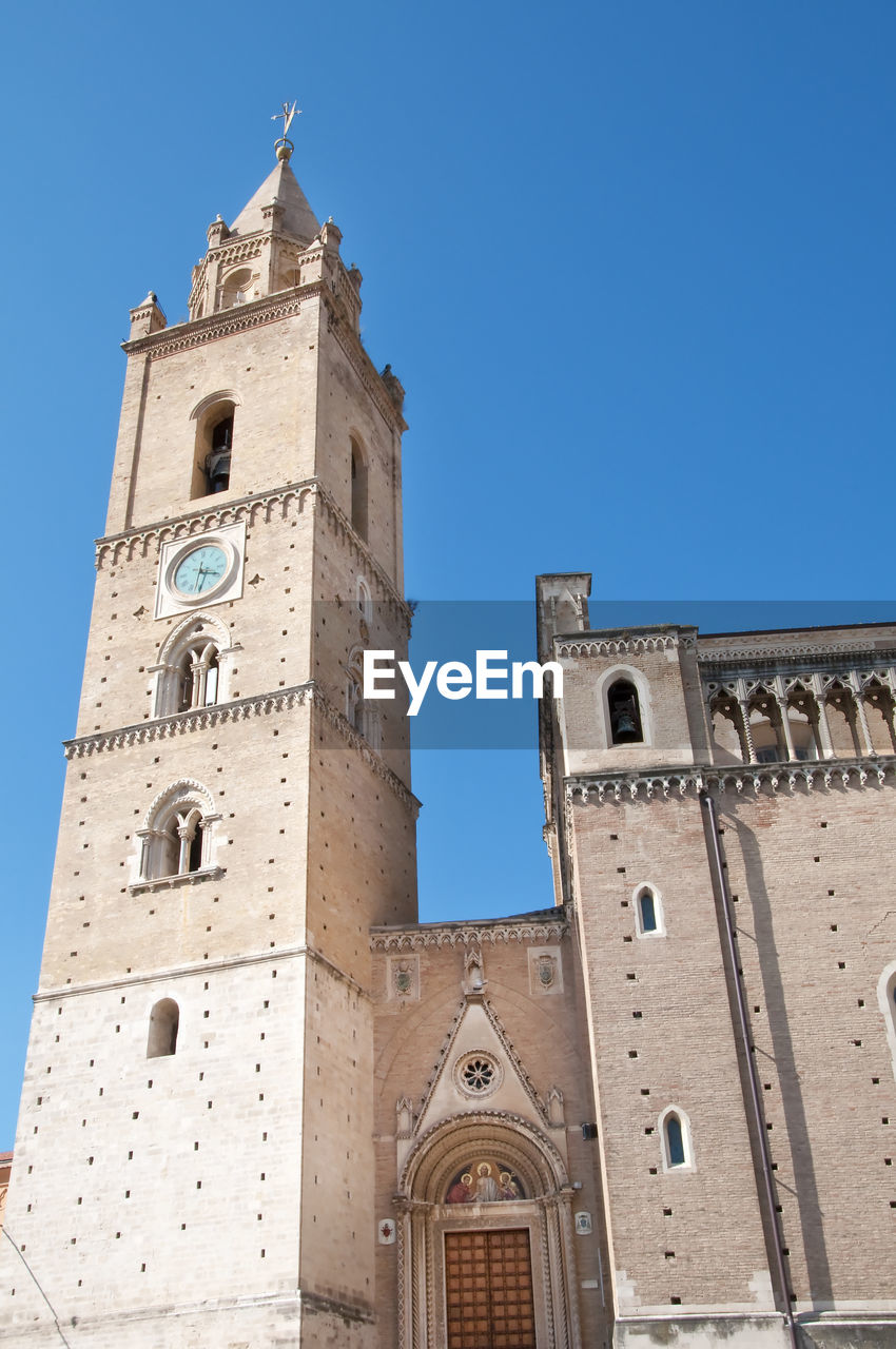 Low angle view of historic church building in chieti against clear blue sky