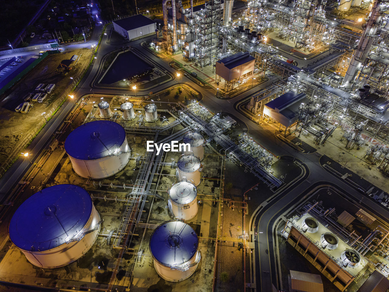 High angle view of illuminated buildings in city at night