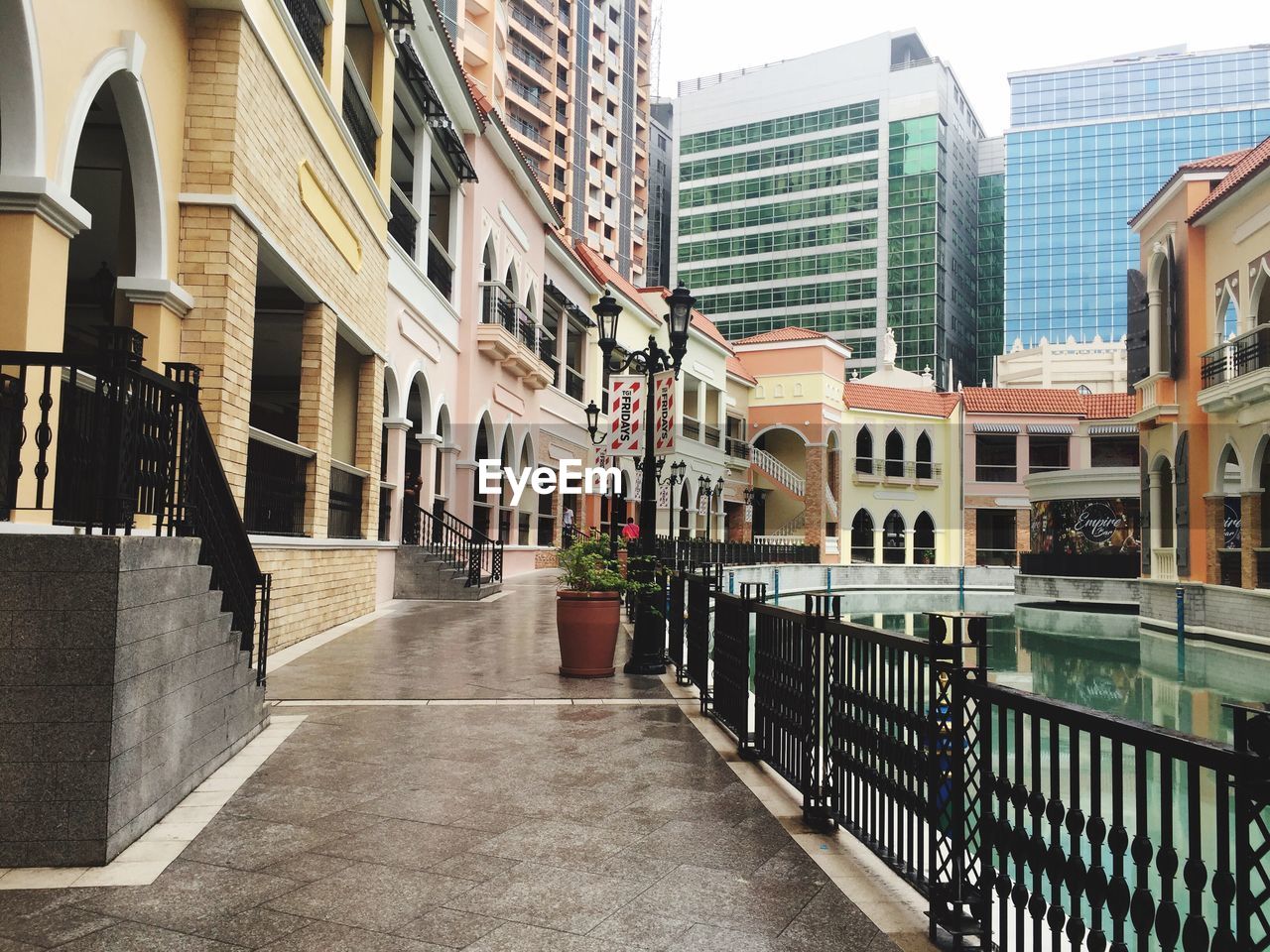 NARROW STREET LEADING TOWARDS SKYSCRAPERS