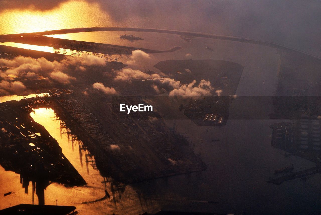 AERIAL VIEW OF CITYSCAPE SEEN THROUGH AIRPLANE