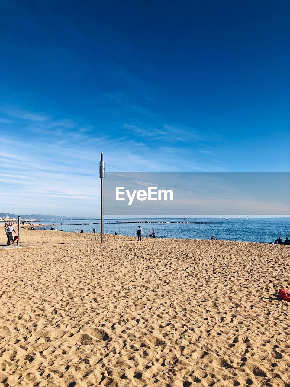 Scenic view of beach against blue sky