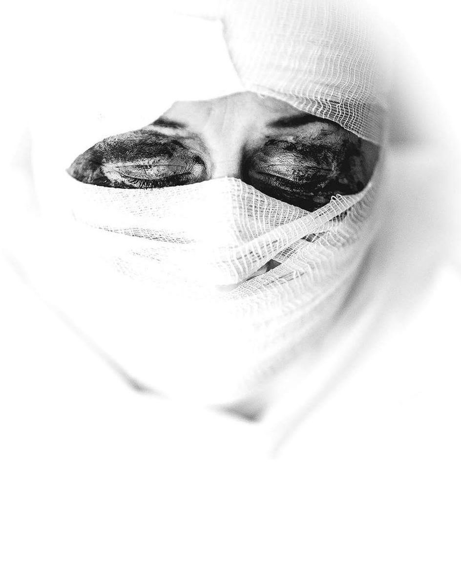 Close-up of woman with closed eyes in mummy costume