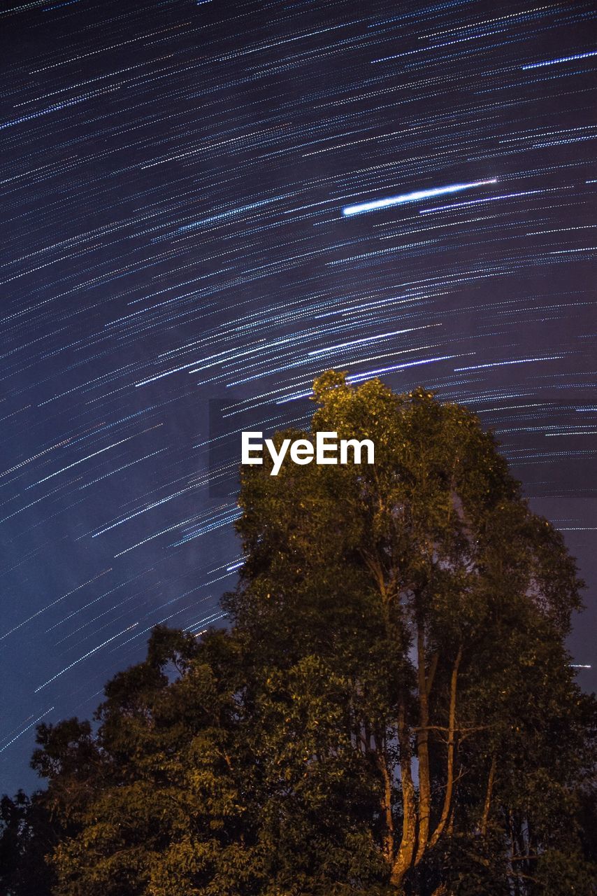 Low angle view of star trails