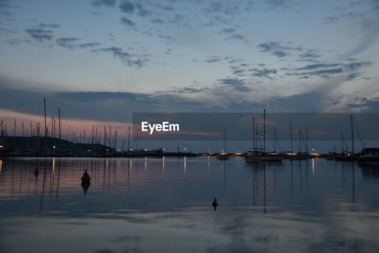 water, reflection, nautical vessel, sky, cloud - sky, nature, sunset, outdoors, transportation, mast, moored, sea, sailboat, harbor, beauty in nature, scenics, no people, day