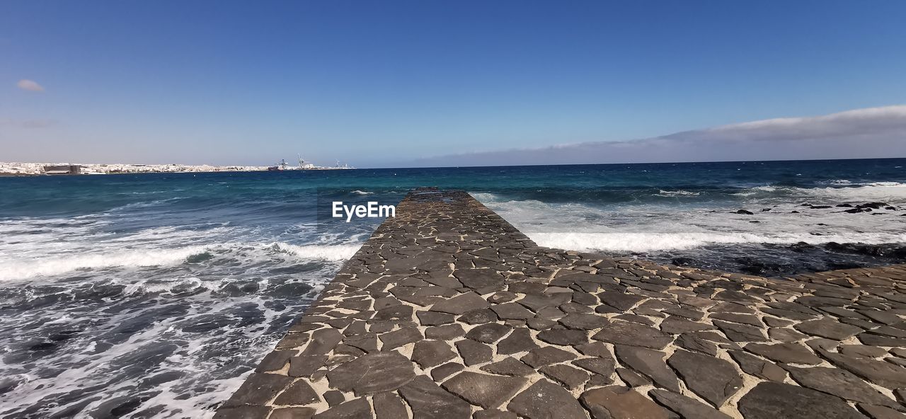 Scenic view of beach against sky