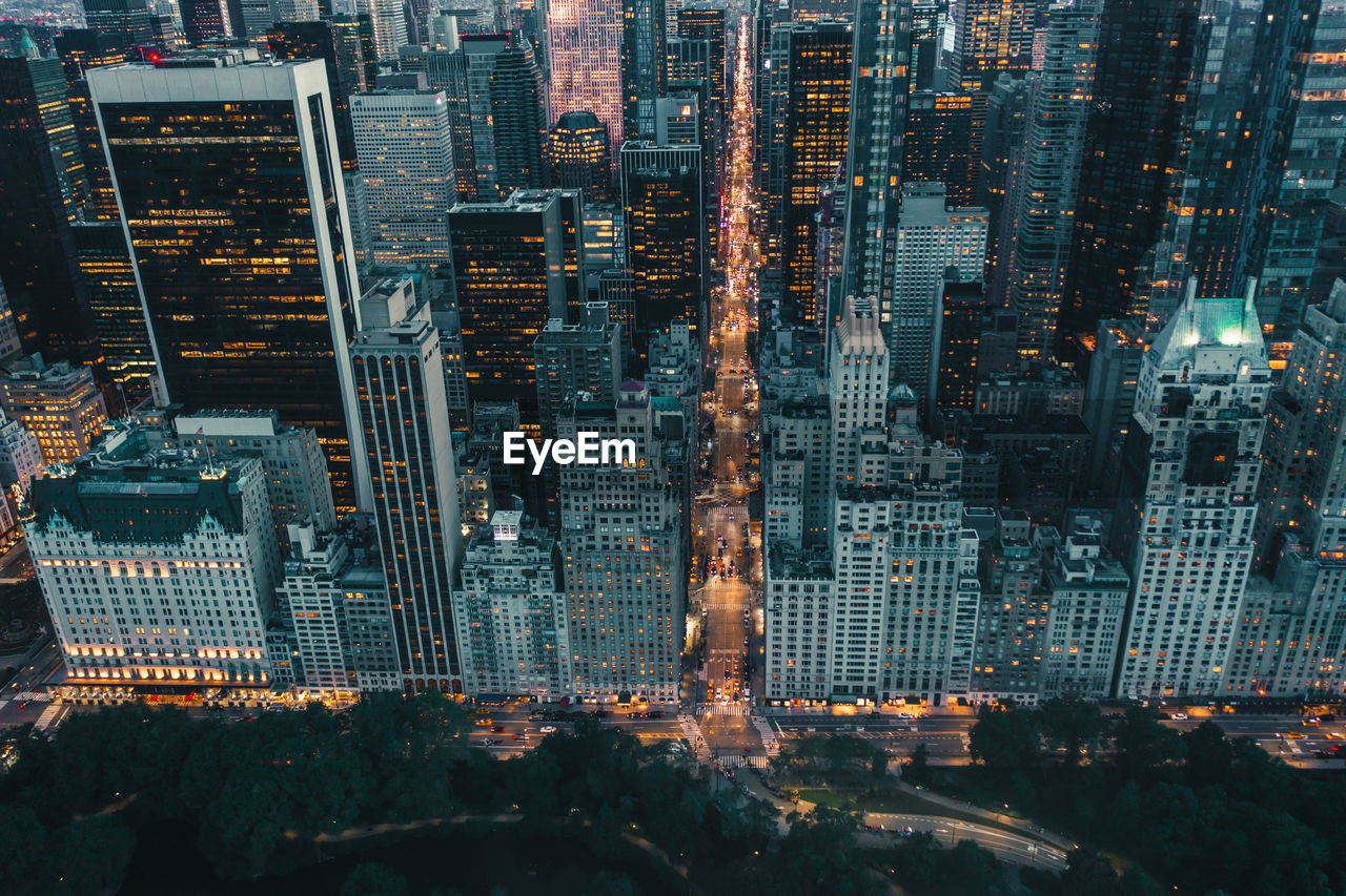 Aerial view of illuminated buildings in city at night