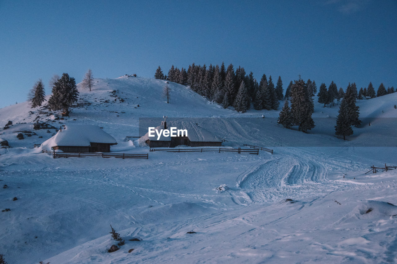 Blue hour winter landscape on velika planina