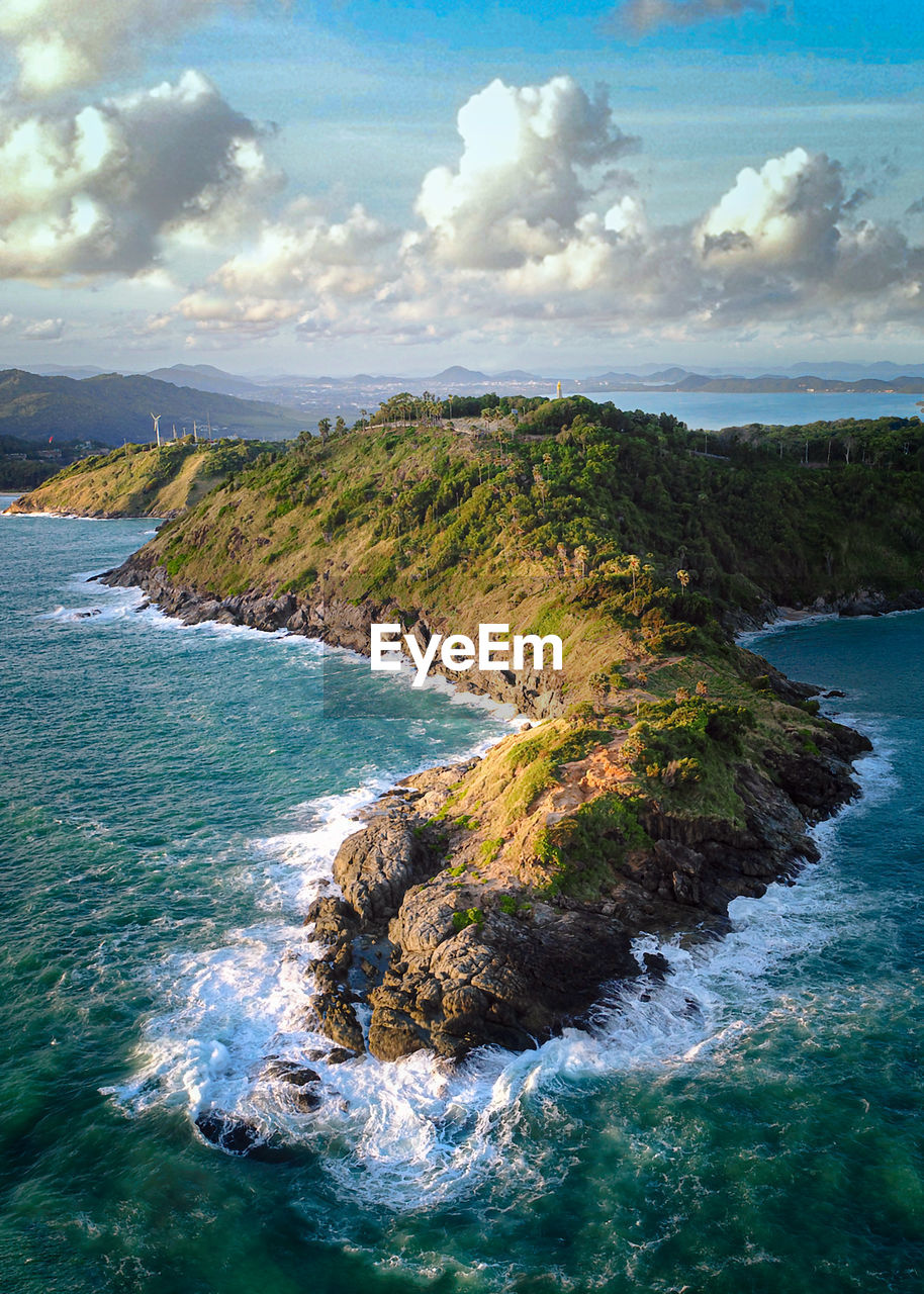 SCENIC VIEW OF ROCKS ON SEA AGAINST SKY