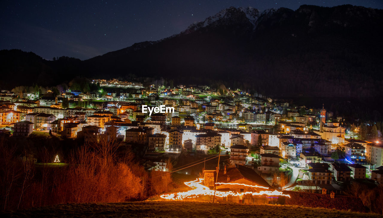 High angle view of illuminated buildings in city at night