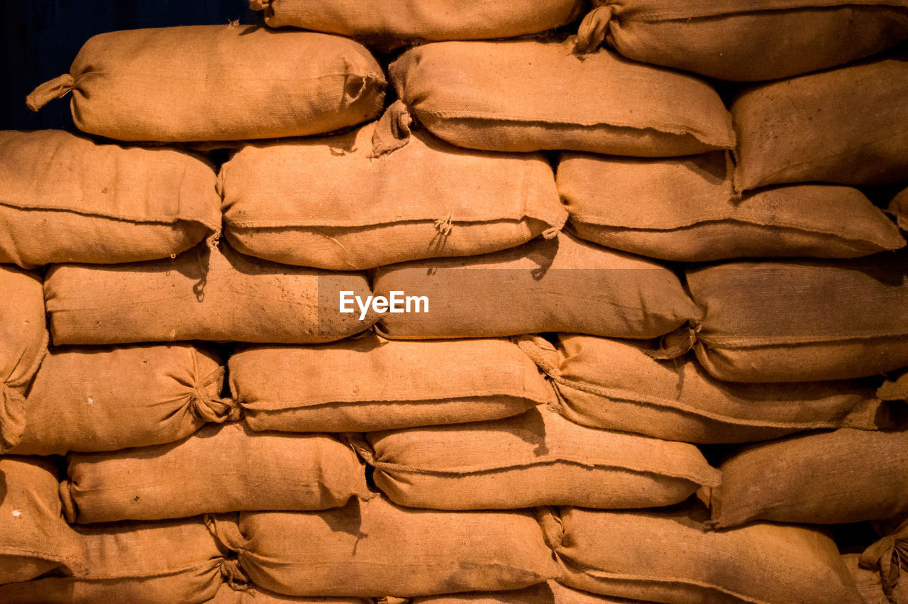 FULL FRAME SHOT OF STACK OF FIREWOOD