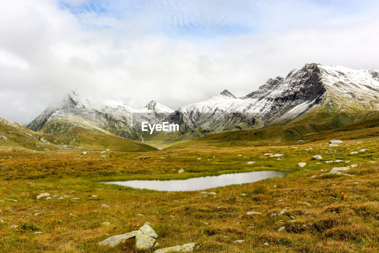 Landscape with mountain lake in swiss alps