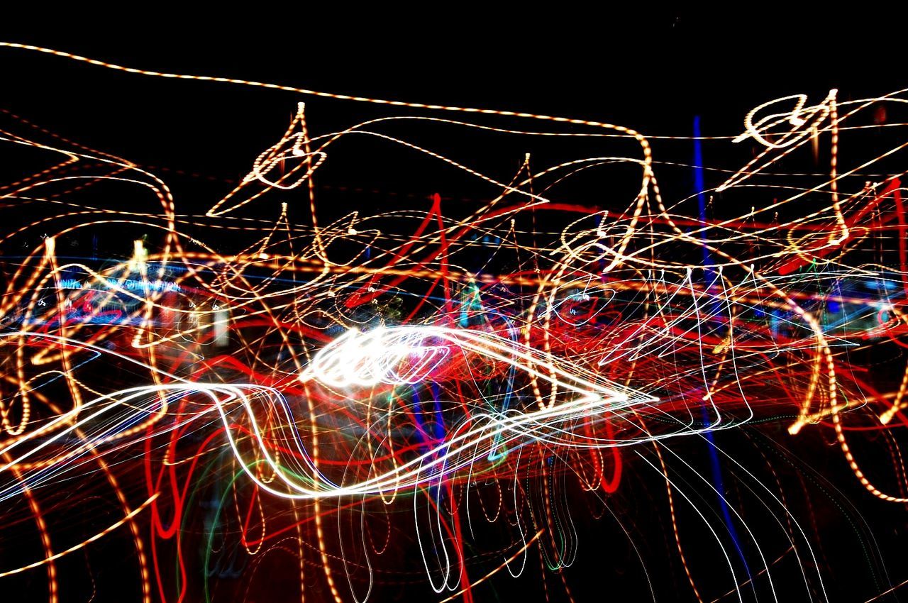 CLOSE-UP OF ILLUMINATED LIGHT TRAILS