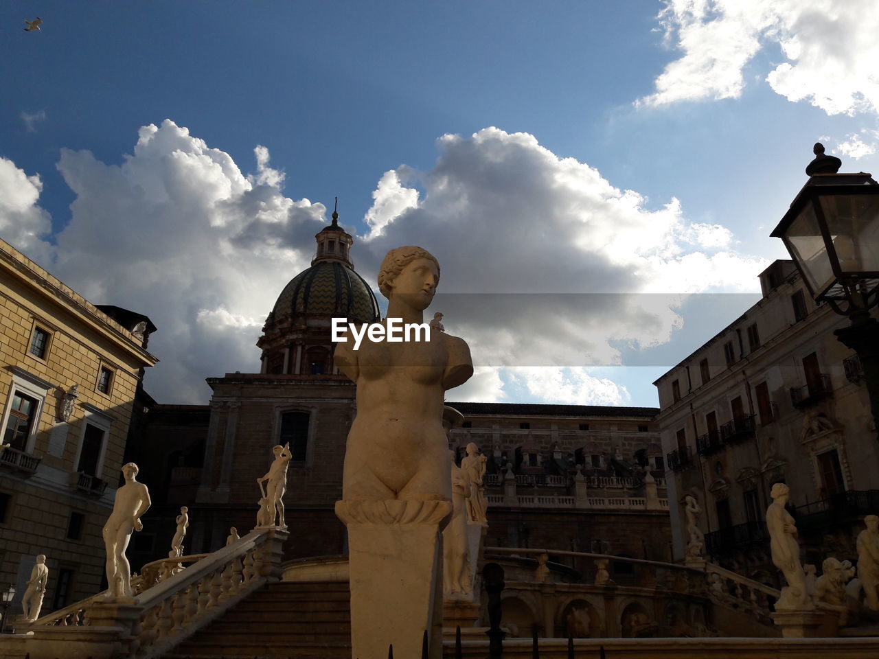 LOW ANGLE VIEW OF SCULPTURE AGAINST SKY