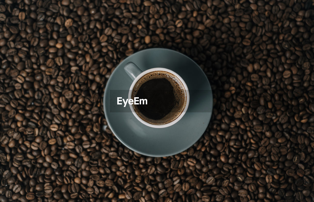 HIGH ANGLE VIEW OF COFFEE BEANS ON FLOOR