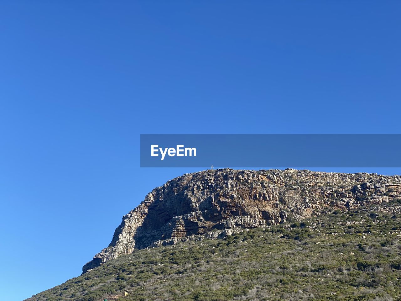 LOW ANGLE VIEW OF ROCK FORMATION AGAINST SKY