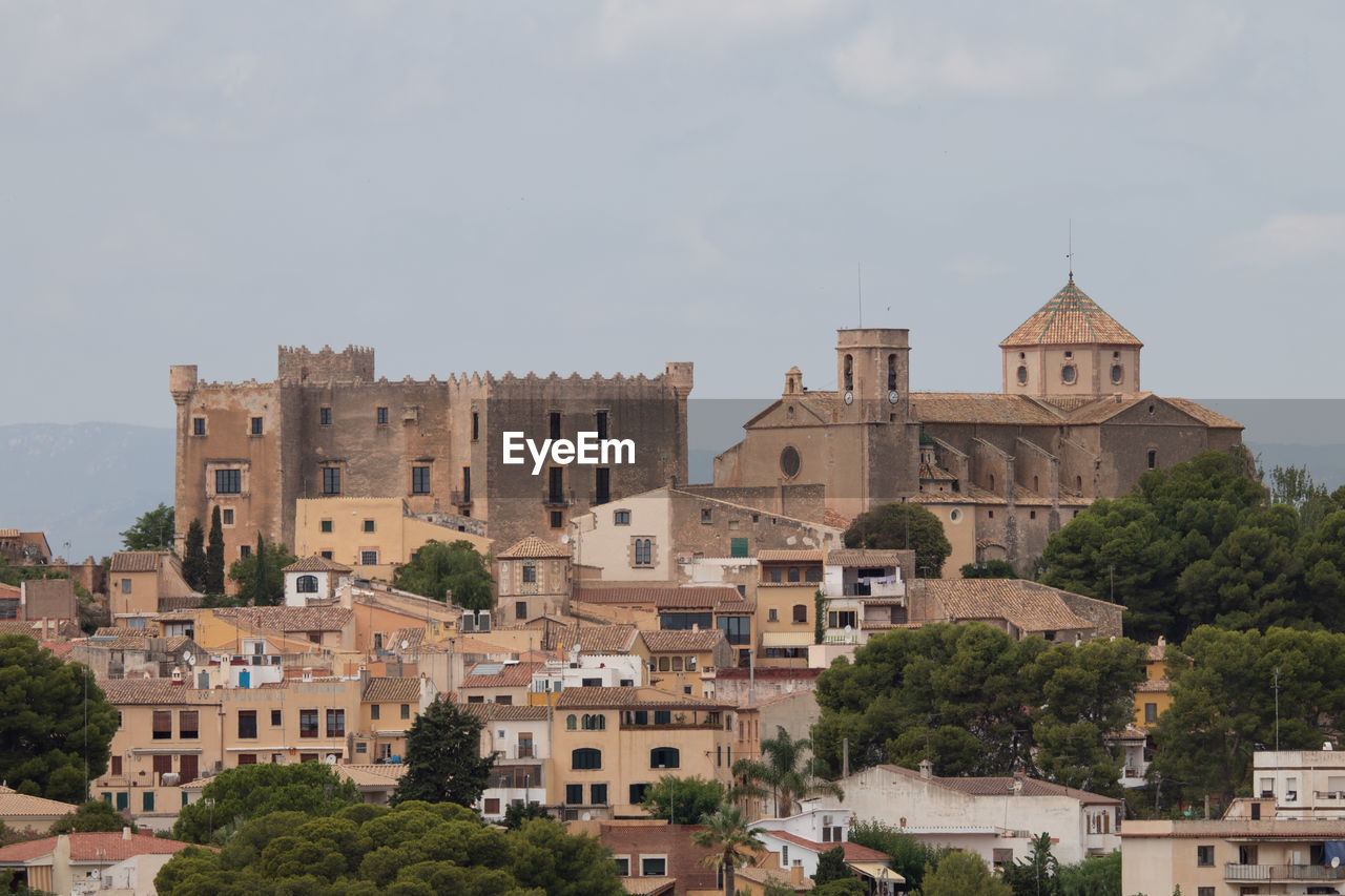 Buildings in city against sky