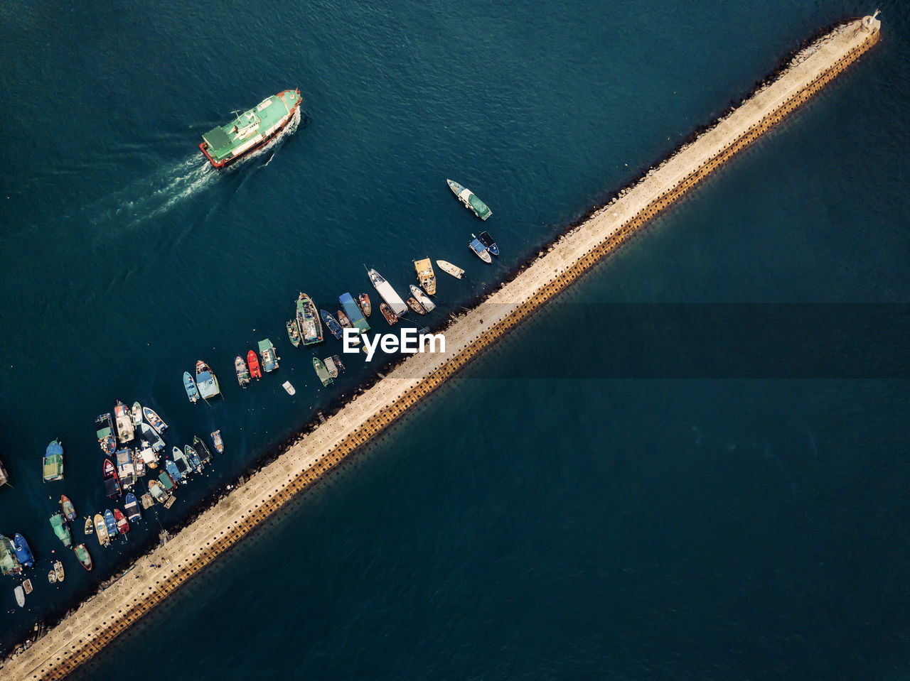 Small fishing boats near the wave barrier in aberdeen bay hong kong