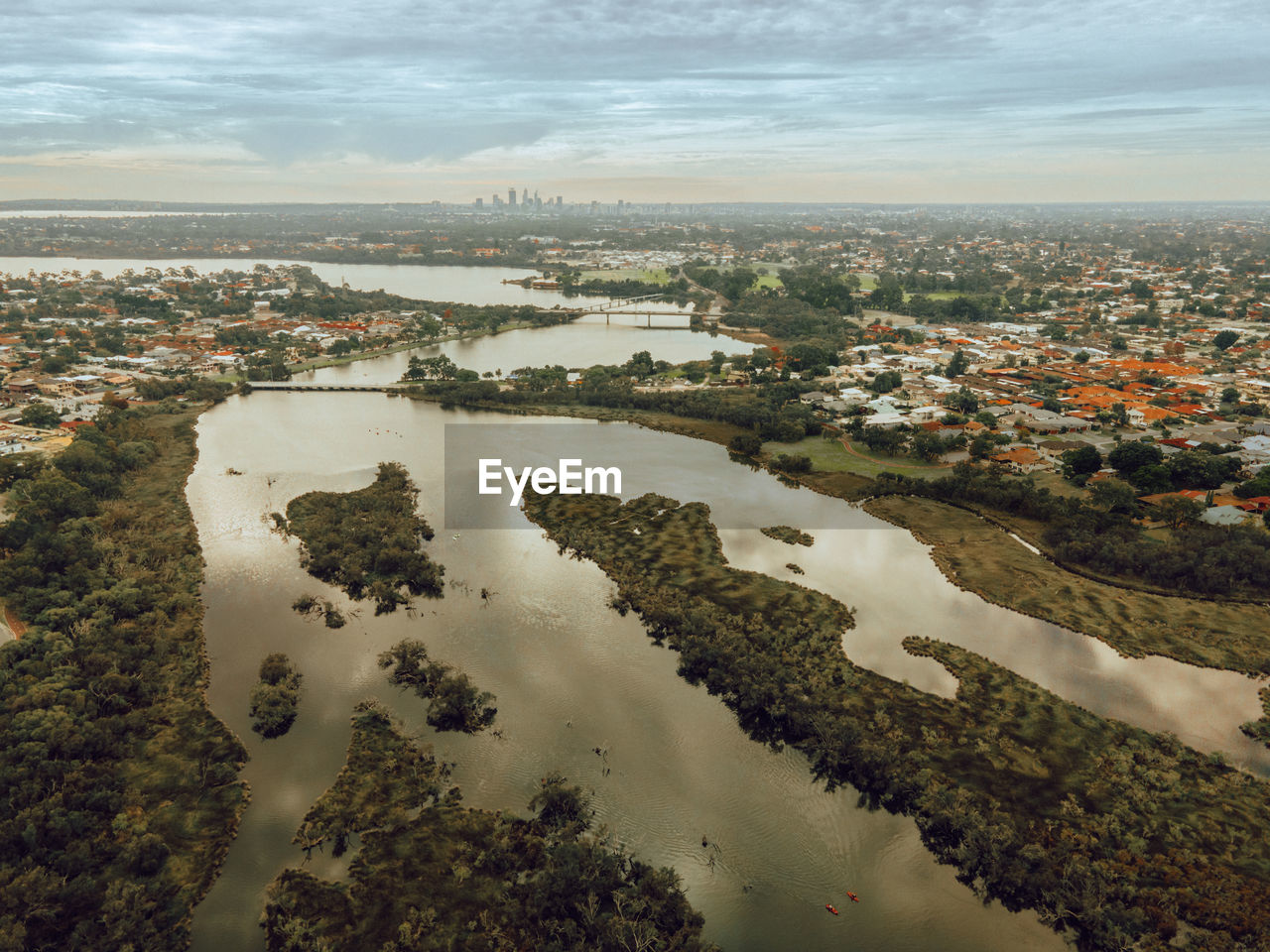 High angle view of river amidst buildings in city