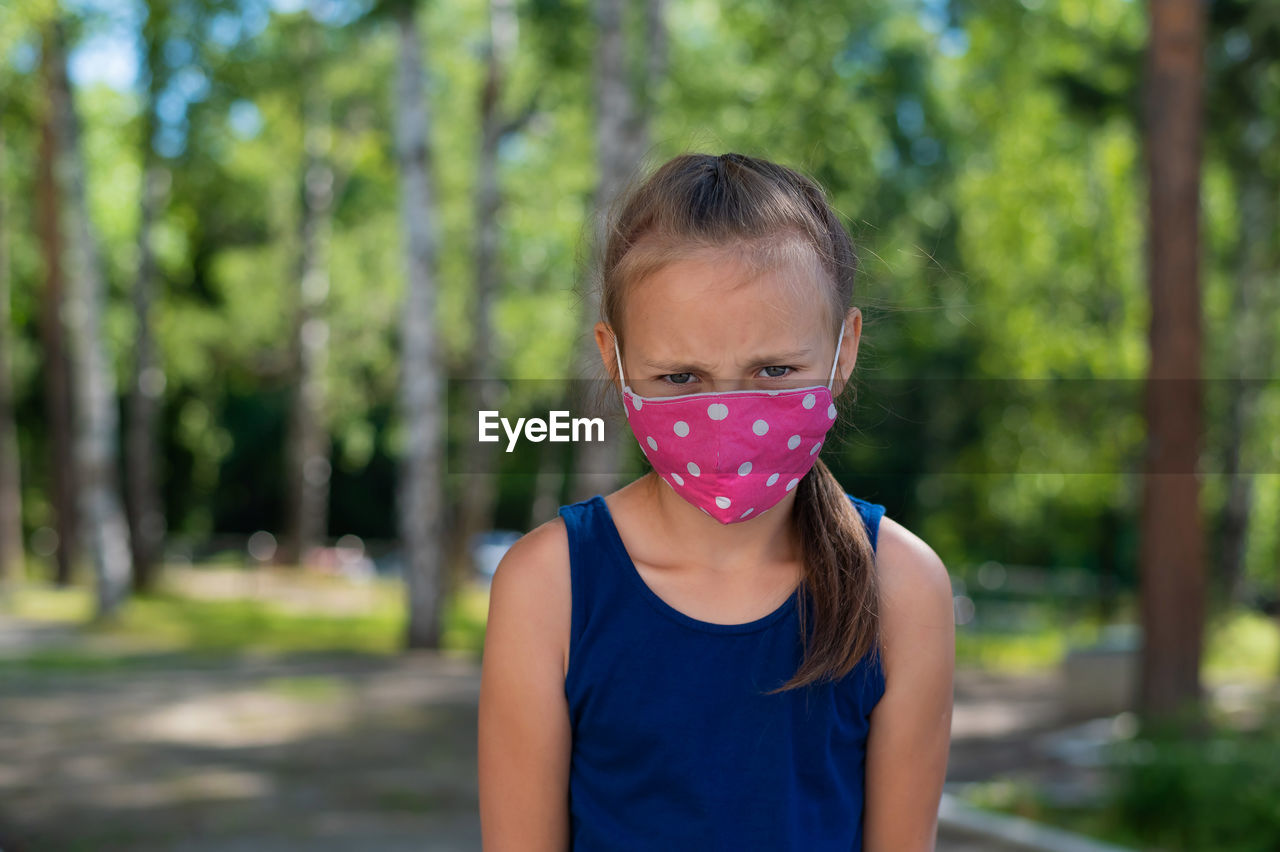 Portrait of girl standing outdoors