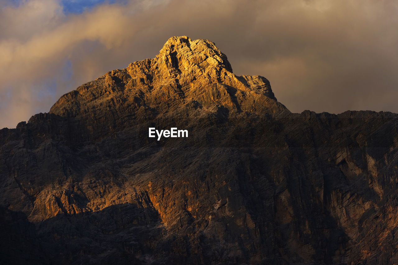 Rocky landscape against clouds