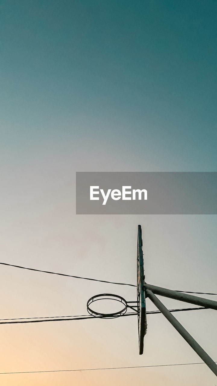 Low angle view of basketball hoop against sky