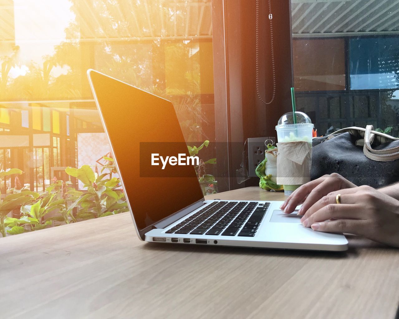 Woman using laptop on table at home