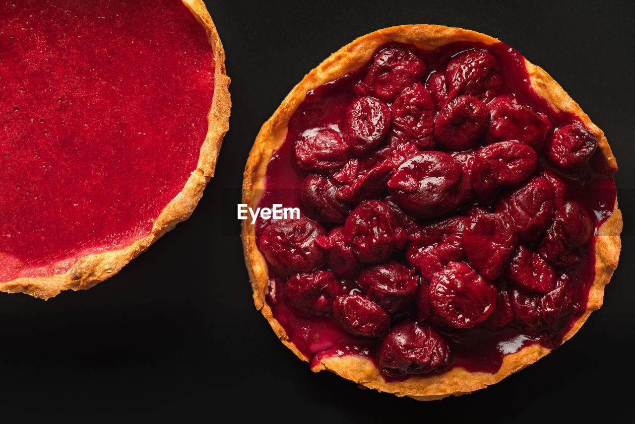 HIGH ANGLE VIEW OF RASPBERRIES ON TABLE