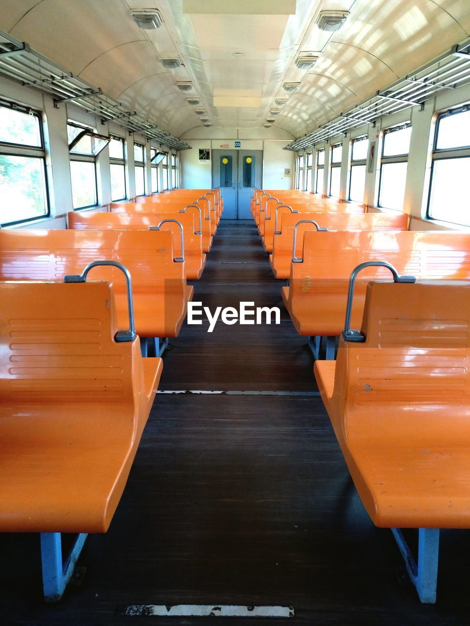 Empty orange seats in train