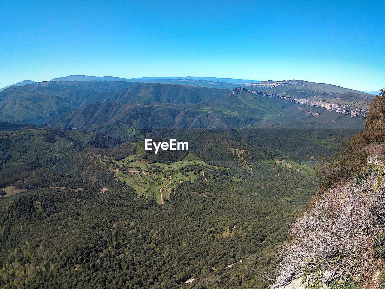 SCENIC VIEW OF MOUNTAINS AGAINST CLEAR SKY