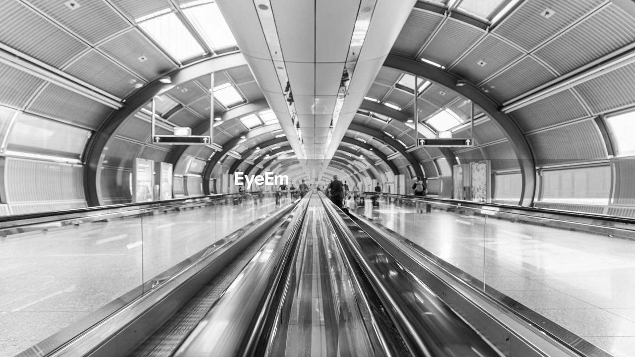 high angle view of man walking on escalator