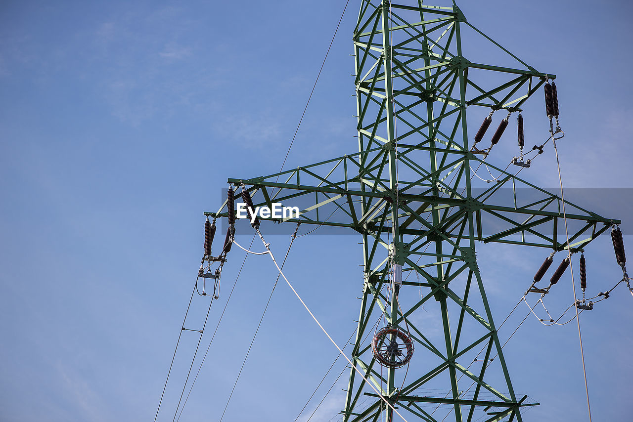 LOW ANGLE VIEW OF ELECTRICITY PYLONS