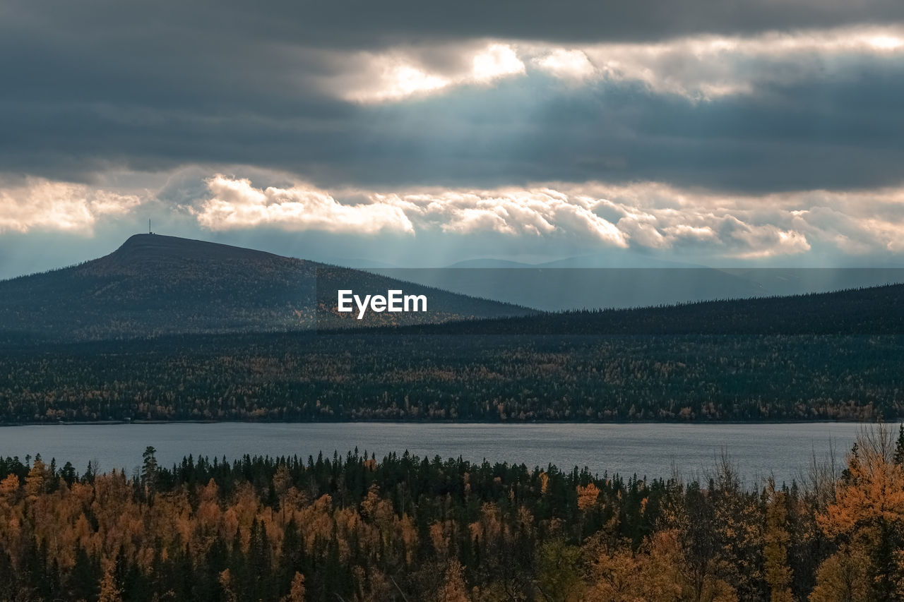 Scenic view of lake against sky during sunset