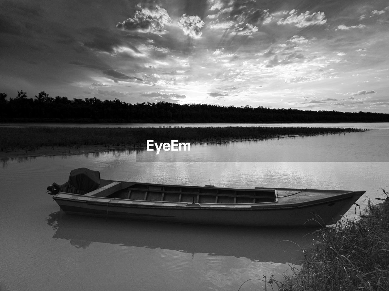 water, nautical vessel, sky, lake, transportation, reflection, cloud, nature, black and white, mode of transportation, vehicle, boat, tranquility, beauty in nature, monochrome photography, scenics - nature, monochrome, tranquil scene, no people, moored, plant, landscape, outdoors, travel, rowboat, tree, environment, watercraft, non-urban scene, travel destinations, beach